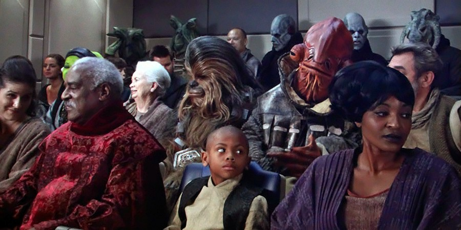 Passengers seated in the cabin of a StarSpeeder 1000 chartered by Star Tours