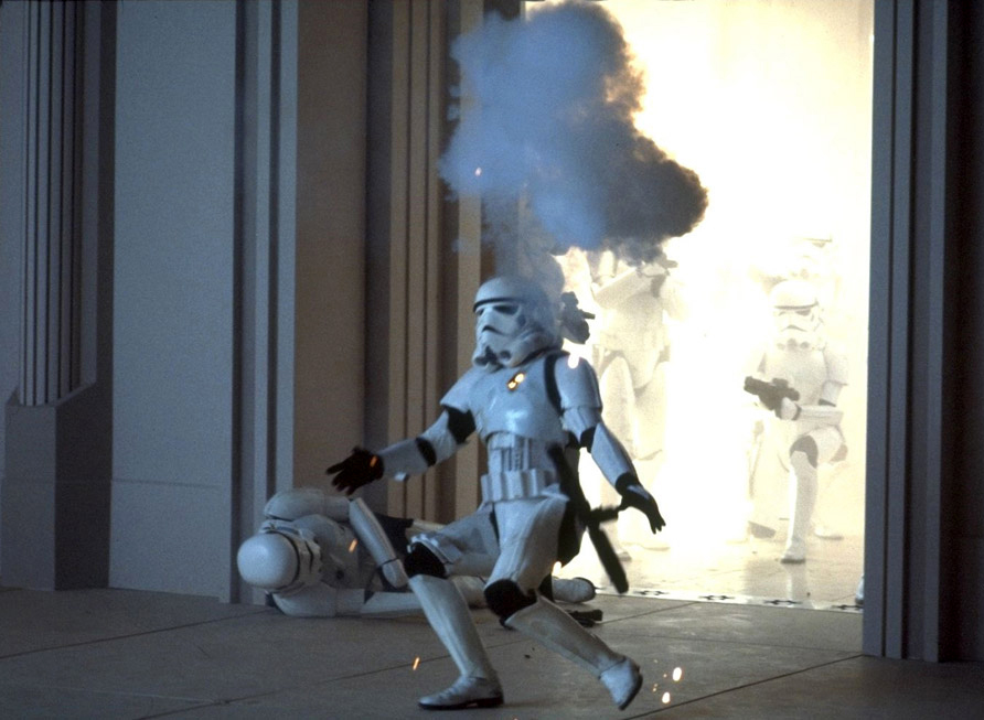 Stormtroopers fall to incoming blaster fire penetrating their armor.