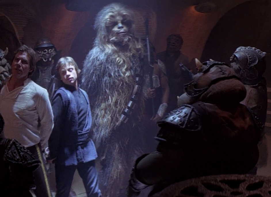 Geezum (center-right) witnessed Jabba sentence Solo, Skywalker and Chewbacca to death.