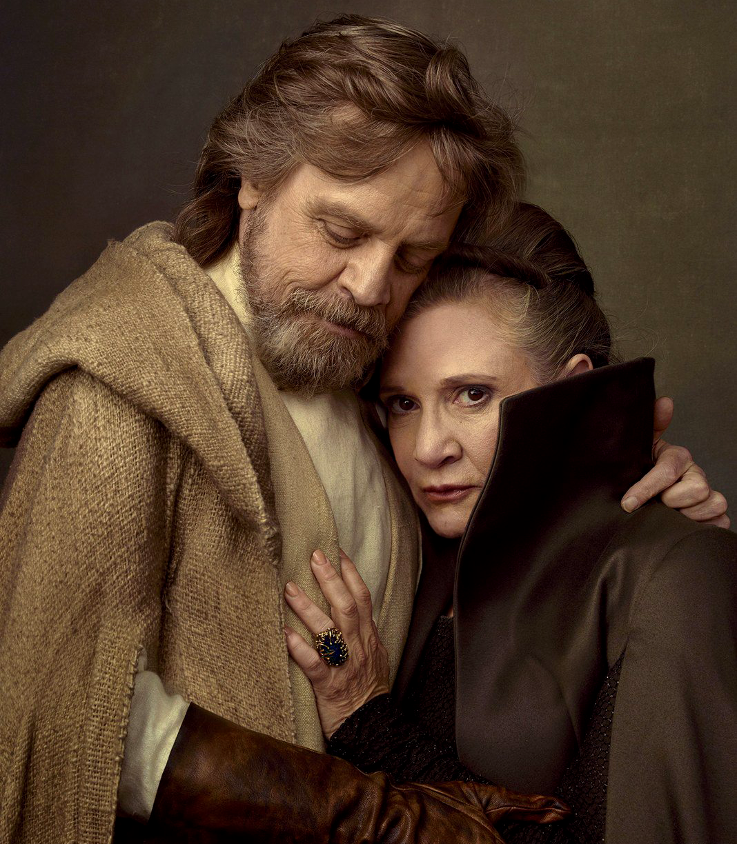 Fisher poses with Mark Hamill in a promotional publicity photo for The Last Jedi shortly before her death