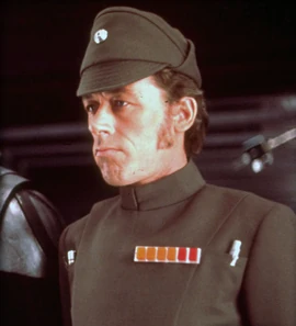 General Bast stands next to Vader aboard the Death Star