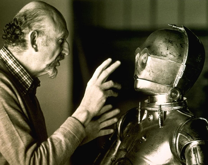 Anthony Daniels rehearses a scene with director Irvin Kershner during filming of The Empire Strikes Back.