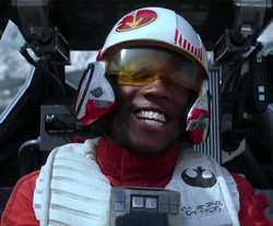 Lieutenant Bastian cheers in the cockpit of his T-70 X-wing.
