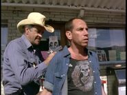 Deputy Kingsolving (Jim Haynie) takes Lloyd Henreid (Miguel Ferrer) into custody after his botched robbery.