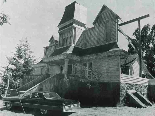 The facade of the Marsten House during filming of the mini-series in the summer of 1979. Note the roof of the actual house on the right side.