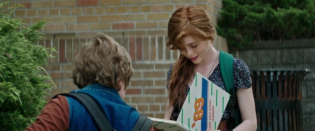 Beverly opens Ben's Derry High School yearbook for him