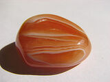 235px-Carnelian - tumble polished stone