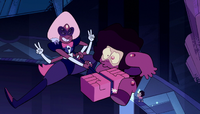 Sardonyx slams her hammer into the Ruby fusion on the moon.