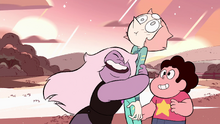 Amethyst happily hugs a surprised Pearl as Steven smiles.