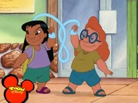 Lilo in a purple T-shirt and green shorts