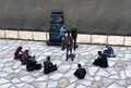 Cadets gather around a library computer before it was moved into a circular building