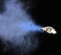 A Yellowstone Class Runabout ejects Tetryon Plasma from its engines.