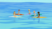 The Tropical Tan models on their surf lesson with Fin...