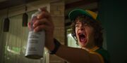 S3E1-Dustin using his hairspray