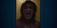 Billy pounding and screaming at the Party to open the door.