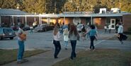 S1E02 Hawkins High School students walking to school