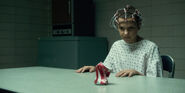 Eleven crushing the can.