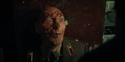 S4E9-Melnikov explaining the massacre