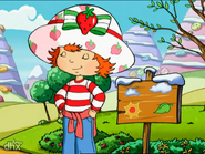 Strawberry Shortcake standing with her eyes closed.