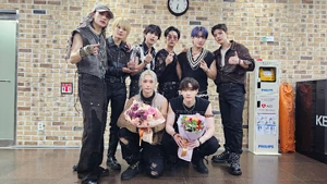 Stray Kids with the Music Bank trophy for "" (Jul