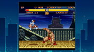 Zangief sweeping Chun-Li in Street Fighter II Turbo: Hyper Fighting for the Super Nintendo.