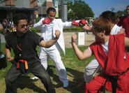 Harada and Kazuya Vs. Ono and Ryu at the San Diego Comic-Con (2011).