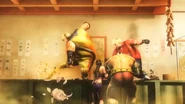 Rufus vs Bob whilst Julia and Zangief look on.in a SFxTK trailer.