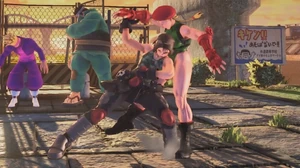 Akira thrusting her shoulder into 's midsection during Shin'Iha.
