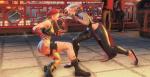 A.K.I thrusting her claws into Cammy.