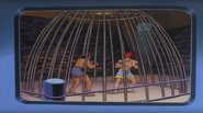 Adon and other fighter in a cage match.