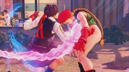 Sakura hitting Cammy with her Shouoken at the end of Sakura Rain.