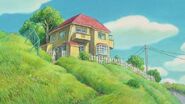 The house on top of the hill, seen from a distance.