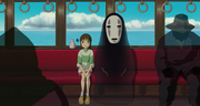 No-Face and Chihiro on the bus