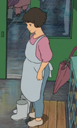 The teacher at her school during a rainstorm.