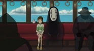 Chihiro, sitting with No Face on the train to Swamp Bottom