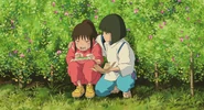 Chihiro, crying while eating Haku's rice balls
