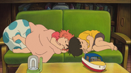 The two kids snoozing on the couch. Aww.