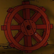 In the Dharma alcove, a large rust-colored wooden wheel rests on the locations border between its two screens.