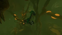 A Sea Monkey in the biome holding a Scanner