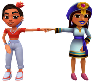 Salma in her Talisman Outfit fist bumping Rosa in her Ceibo Outfit