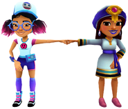 Salma in her Talisman Outfit fist bumping Jenny in her Pixel Outfit