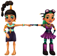 Jasmine in her Ankh Outfit fist bumping Nina in her Cyberpunk Outfit