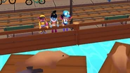 Miss Maia, Amira in her Genie Outfit, and Jenny in her Pixel Outfit looking at the seals in