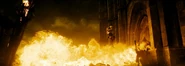 Babydoll evades the dragon's flames.