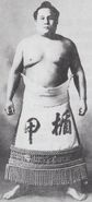 Tatekabuto poses with his kesho-mawashi