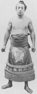 Midorishima poses with his kesho-mawashi