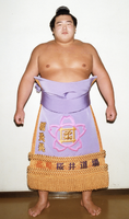 Tochitenko poses with his kesho-mawashi (c. 1993)