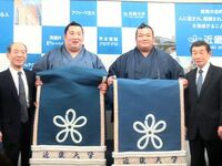 Homarefuji presented with his kesho mawashi (c. 2013)