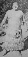 Wakanoshima poses with his kesho-mawashi (c. 1967)