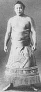Kojimagawa poses with his kesho-mawashi